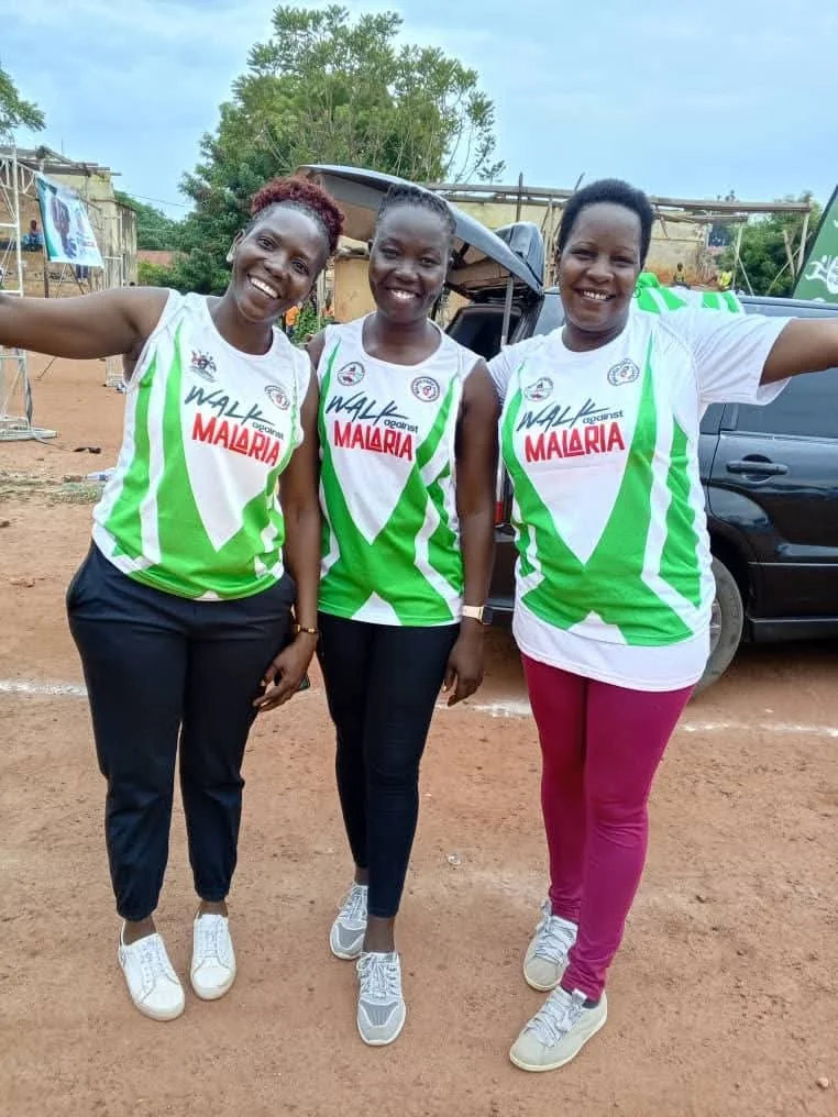 Three participants in Walk Against Malaria shirts